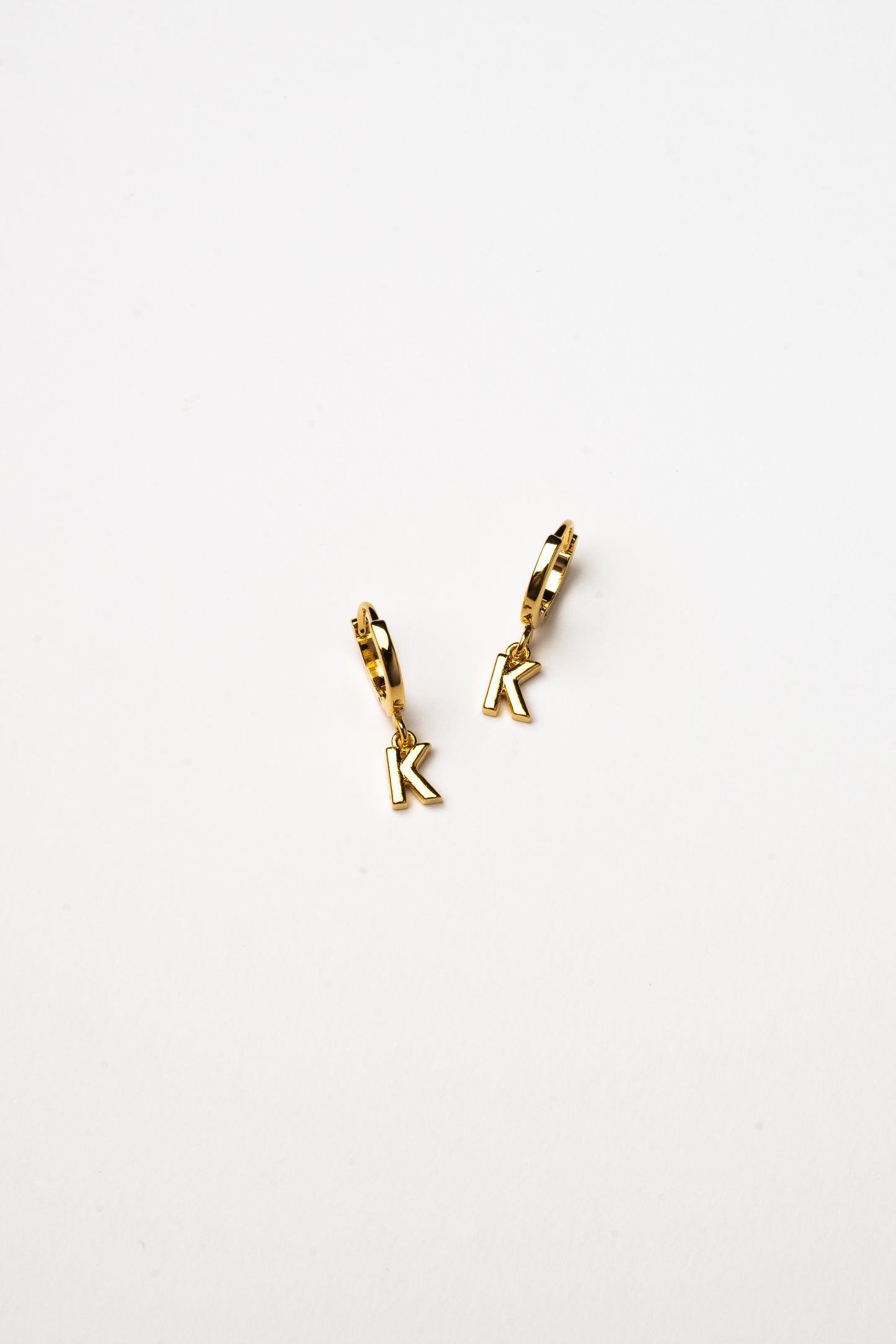 Cove Initial Letter Huggie Earrings