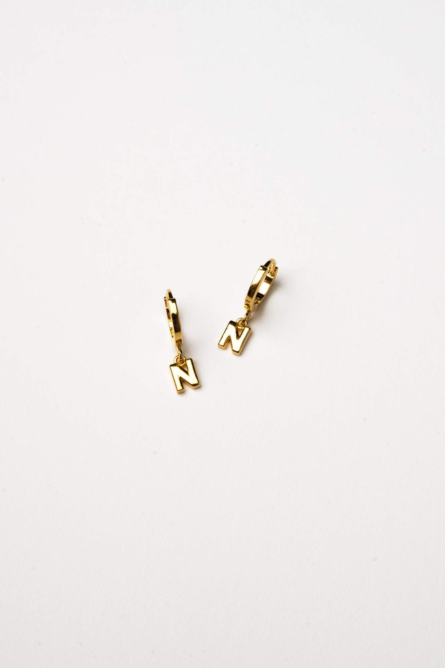 Cove Initial Letter Huggie Earrings