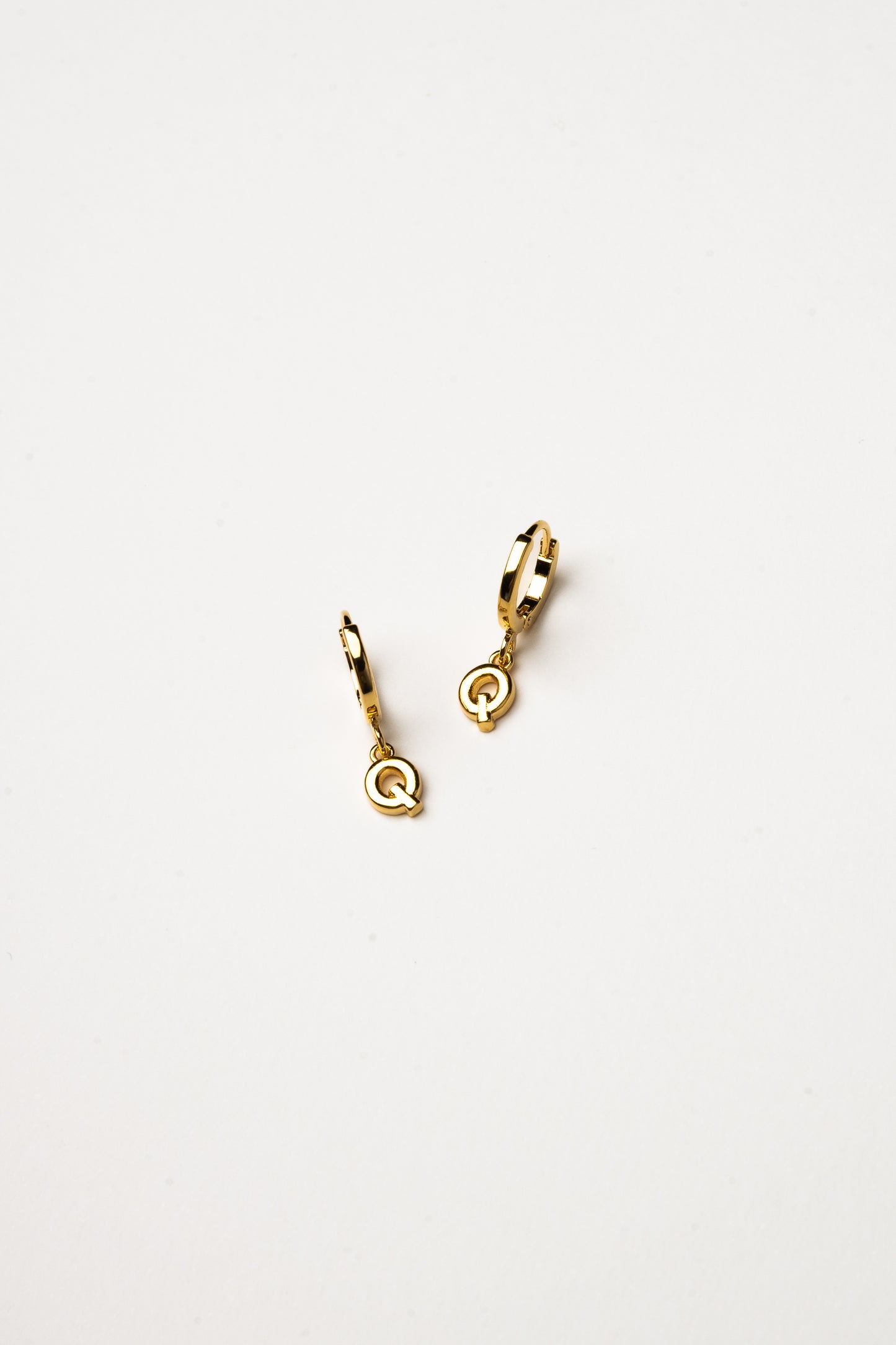 Cove Initial Letter Huggie Earrings