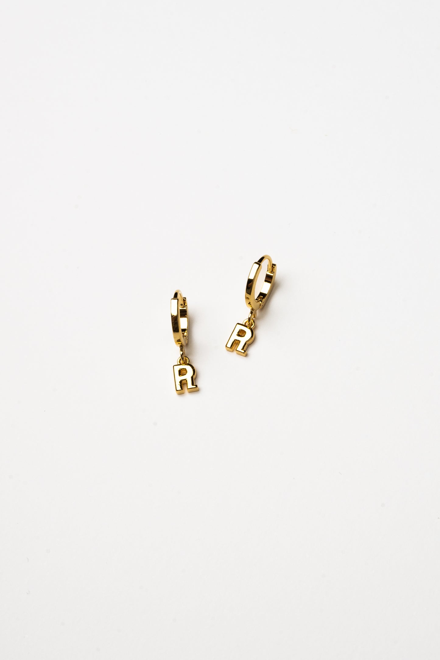 Cove Initial Letter Huggie Earrings