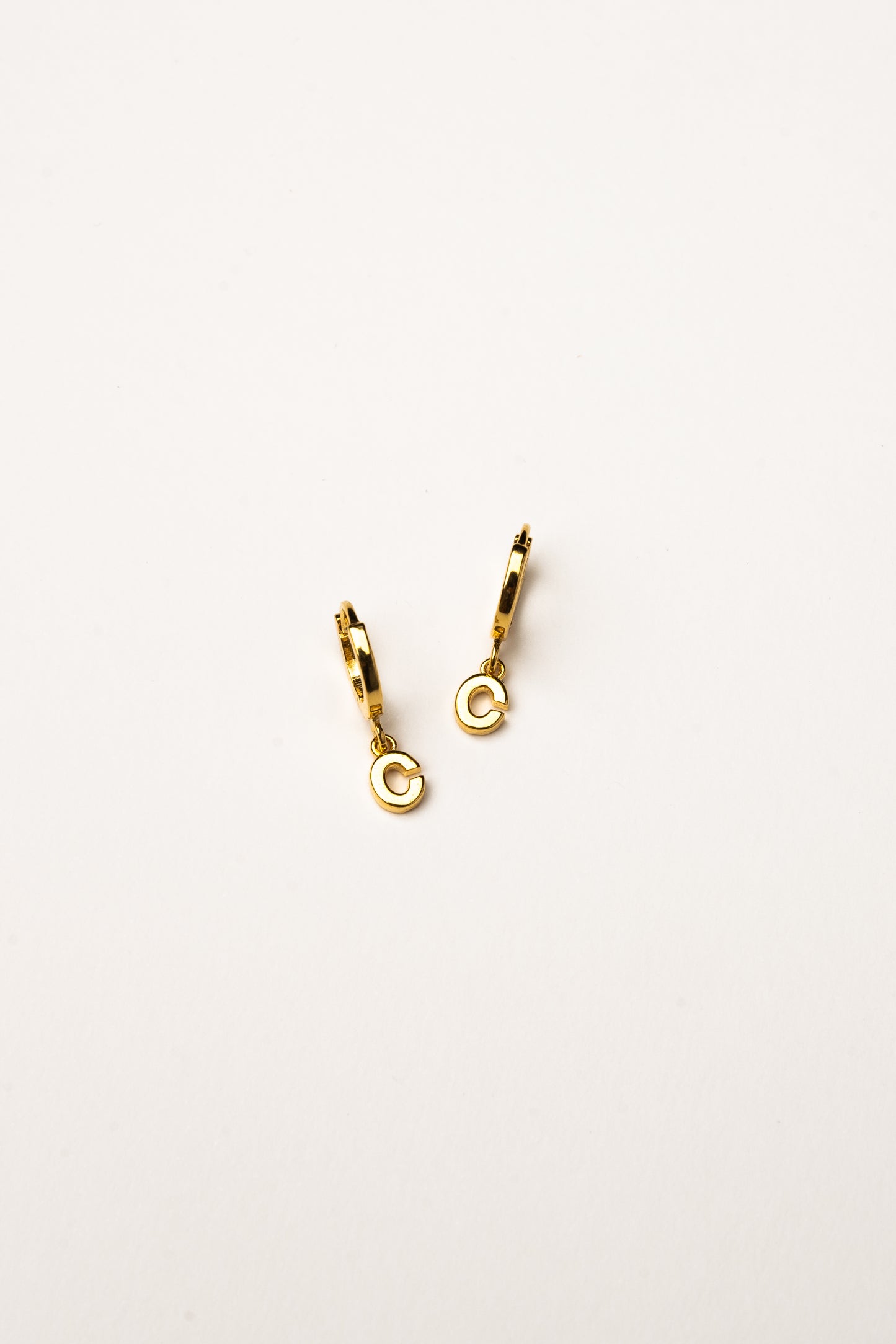 Cove Initial Letter Huggie Earrings