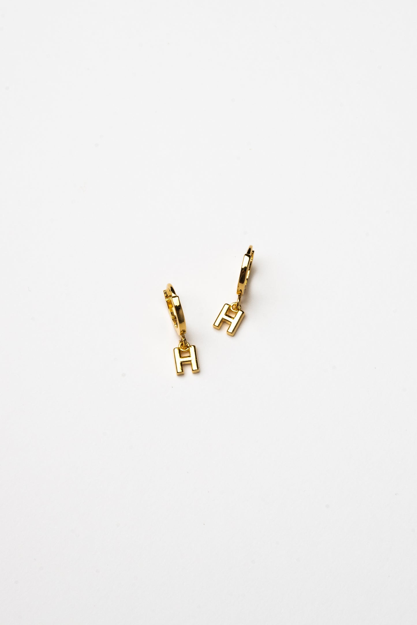 Cove Initial Letter Huggie Earrings