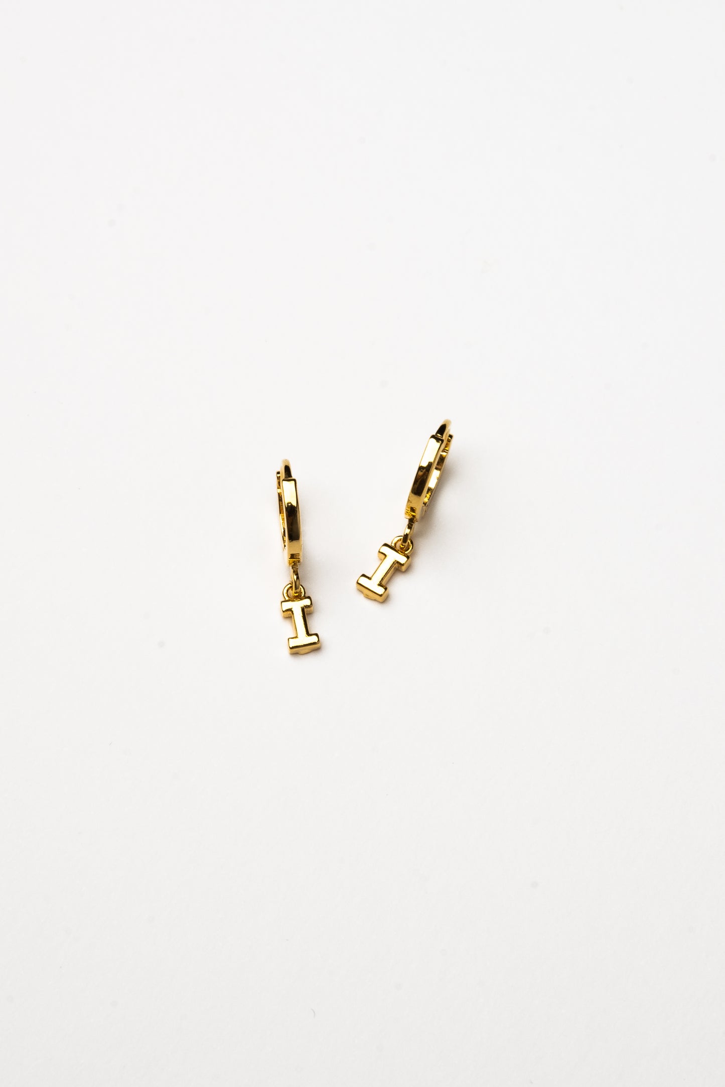 Cove Initial Letter Huggie Earrings