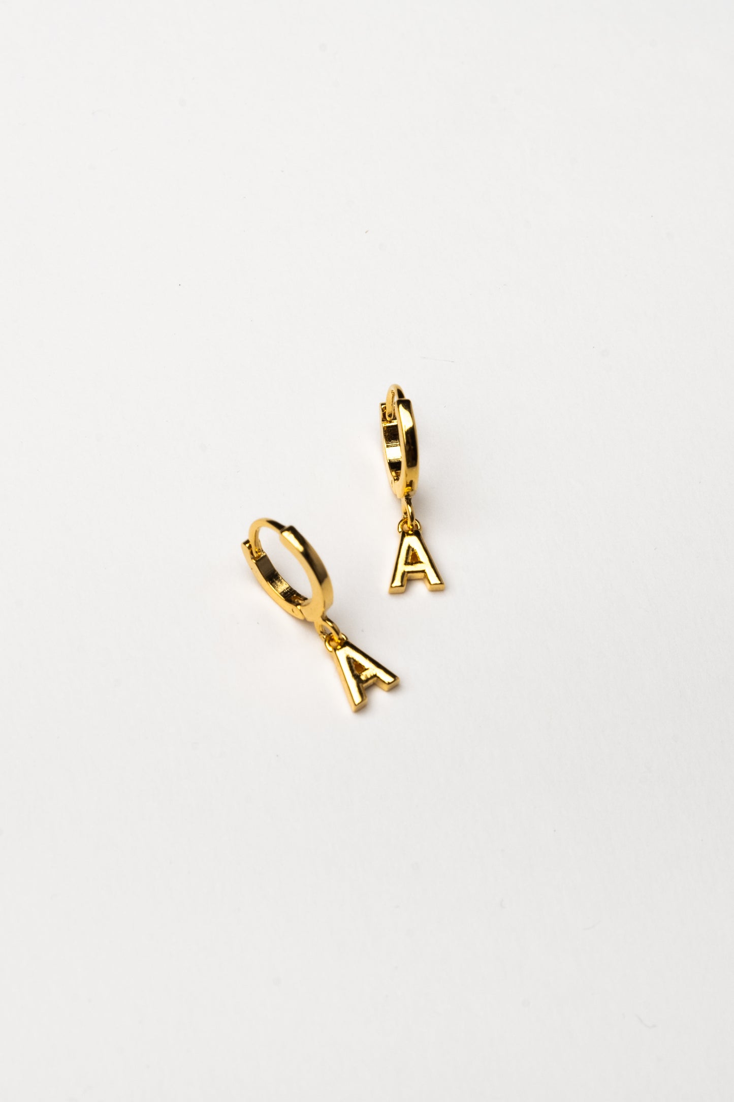 Cove Initial Letter Huggie Earrings